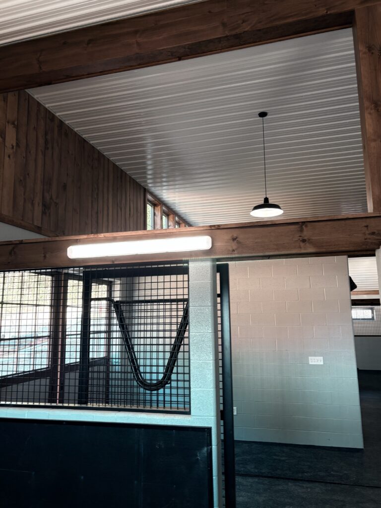 Commercial and industrial electrical installation inside a Delaware facility with finished lighting and power systems