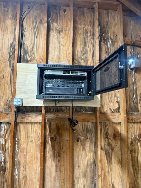 Wall-mounted network and electrical equipment cabinet installed inside a Maryland commercial building